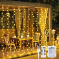 JMEXSUSS 200 LED Christmas Curtain Lights, Warm White, Battery & USB Powered W573